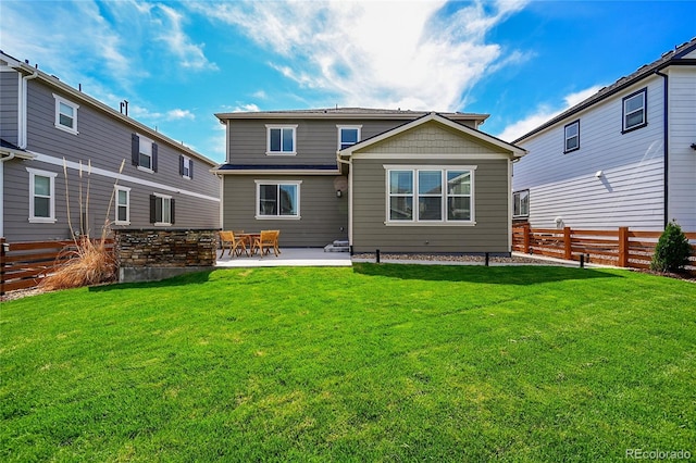 821 Boulder Peak Ave, Erie, CO 80516 - back of property with a patio