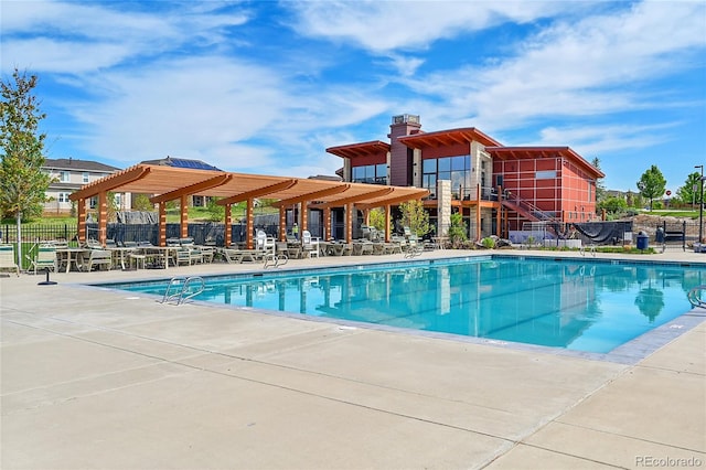 821 Boulder Peak Ave, Erie, CO 80516 - community pool featuring fence and a patio