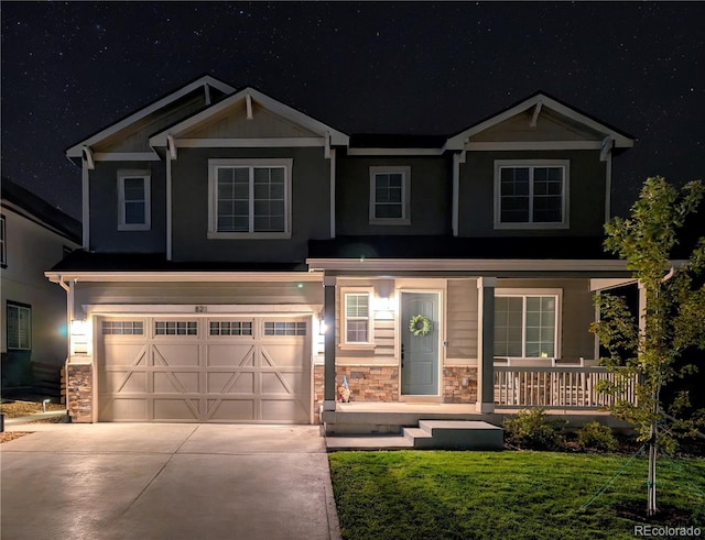 821 Boulder Peak Ave, Erie, CO 80516 - craftsman house featuring stone siding, covered porch, concrete driveway, a garage, and a front yard