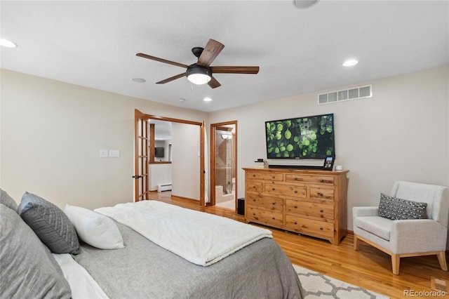 2520 Eldridge Cir, Golden, CO 80401 - bedroom featuring a baseboard heating unit, light wood-type flooring, recessed lighting, connected bathroom, and a ceiling fan