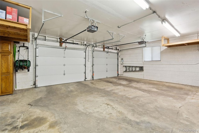 2520 Eldridge Cir, Golden, CO 80401 - garage featuring a garage door opener and concrete block wall