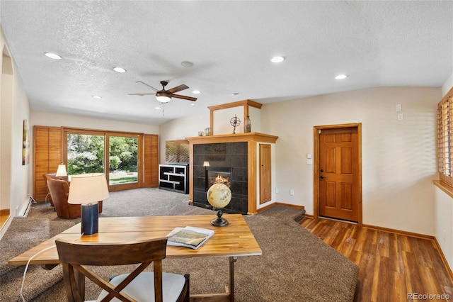 2520 Eldridge Cir, Golden, CO 80401 - living area with ceiling fan, a textured ceiling, a tile fireplace, wood finished floors, and recessed lighting