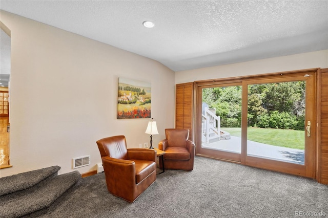 2520 Eldridge Cir, Golden, CO 80401 - living area with carpet, a textured ceiling, arched walkways, and recessed lighting