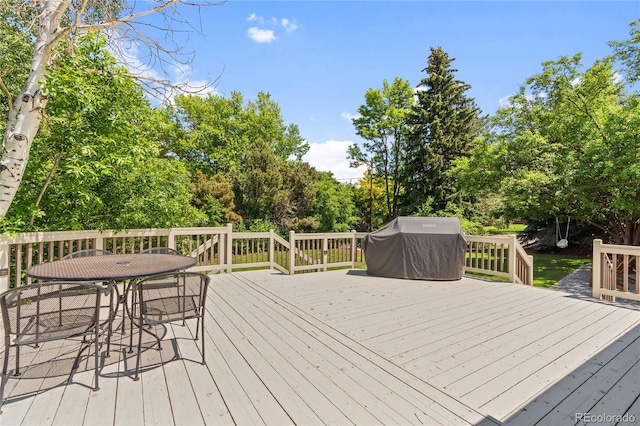 2520 Eldridge Cir, Golden, CO 80401 - wooden terrace featuring outdoor dining space, area for grilling, and view of scattered trees