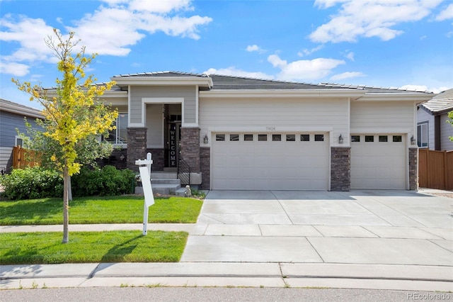 11404 Hannibal St, Commerce City, CO 80022 - prairie-style house featuring a garage and concrete driveway