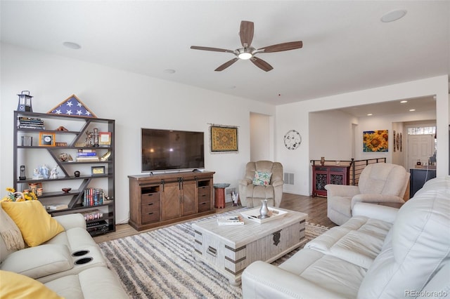 11404 Hannibal St, Commerce City, CO 80022 - living area with wood finished floors and ceiling fan