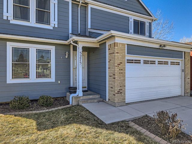 property entrance with brick siding