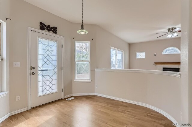 entrance foyer with ceiling fan, light wood-type flooring, and plenty of natural light