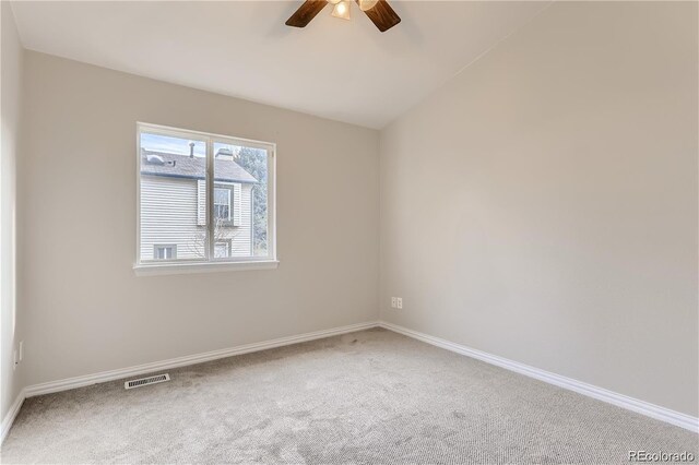 spare room with ceiling fan and carpet flooring