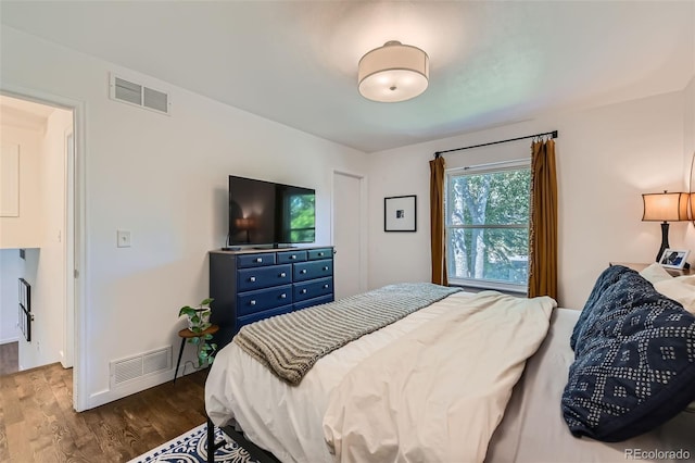 3955 S Nucla St, Aurora, CO 80013 - bedroom featuring dark wood-style floors and baseboards
