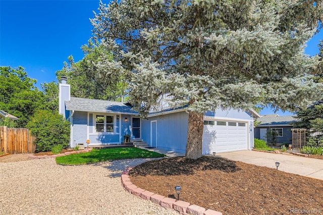 3955 S Nucla St, Aurora, CO 80013 - single story home with concrete driveway, a chimney, and a garage