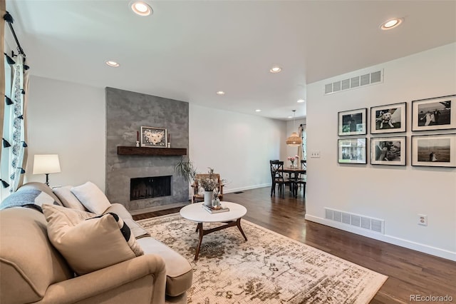 3955 S Nucla St, Aurora, CO 80013 - living area featuring recessed lighting, a fireplace, and dark wood-style floors