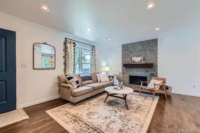 3955 S Nucla St, Aurora, CO 80013 - living area with dark wood-type flooring, recessed lighting, and a fireplace