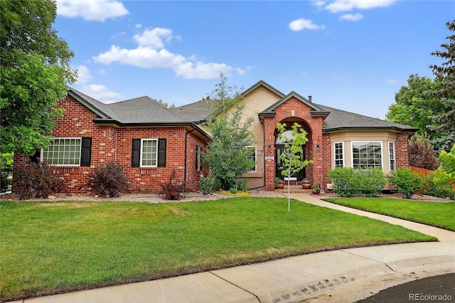 5926 S Elkhart Ct, Centennial, CO 80016 - view of front of property featuring brick siding, a front yard, and roof with shingles