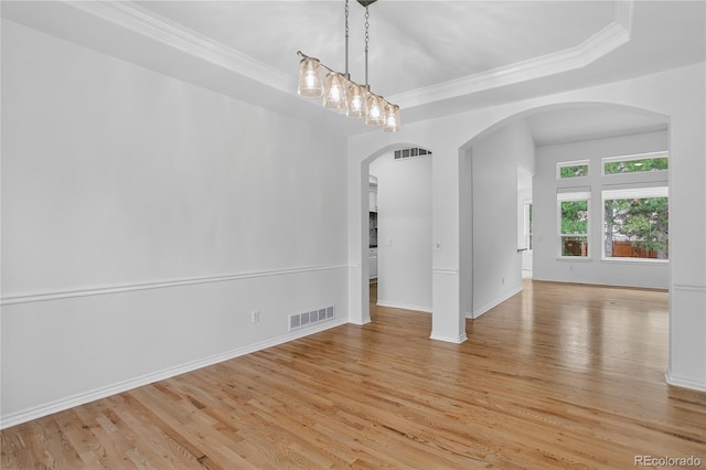 5926 S Elkhart Ct, Centennial, CO 80016 - spare room with light wood-style floors, arched walkways, crown molding, and a raised ceiling