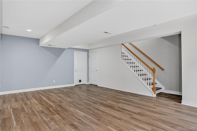 5926 S Elkhart Ct, Centennial, CO 80016 - finished below grade area featuring wood finished floors, stairway, and recessed lighting