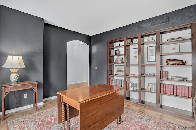 5926 S Elkhart Ct, Centennial, CO 80016 - home office featuring wood finished floors and arched walkways