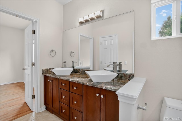 5926 S Elkhart Ct, Centennial, CO 80016 - full bathroom featuring double vanity and tile patterned flooring