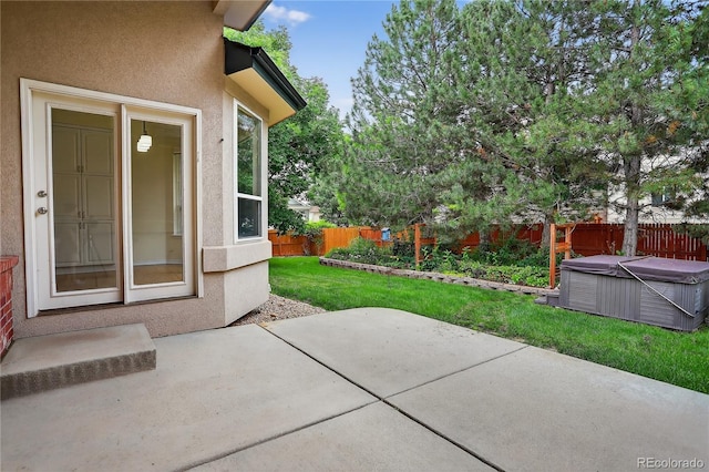 5926 S Elkhart Ct, Centennial, CO 80016 - fenced backyard with a hot tub and a patio