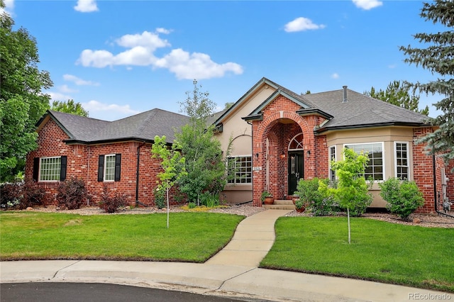 5926 S Elkhart Ct, Centennial, CO 80016 - view of front of property with brick siding, roof with shingles, and a front yard