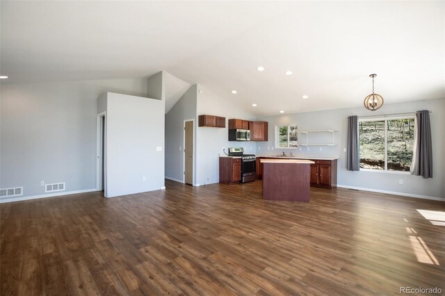 1536 County Road 1, Cripple Creek, CO 80813 - kitchen featuring appliances with stainless steel finishes, open floor plan, a center island, dark wood-type flooring, and recessed lighting