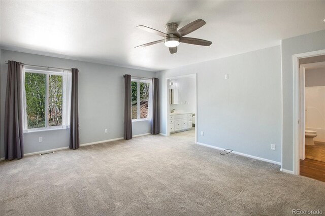 1536 County Road 1, Cripple Creek, CO 80813 - carpeted empty room with a ceiling fan, plenty of natural light, and baseboards