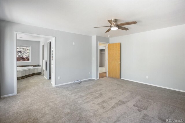 1536 County Road 1, Cripple Creek, CO 80813 - unfurnished bedroom with carpet floors, baseboards, ensuite bath, and ceiling fan