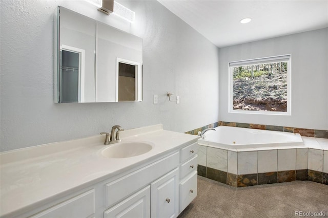 1536 County Road 1, Cripple Creek, CO 80813 - bathroom with vanity, a garden tub, and a textured wall