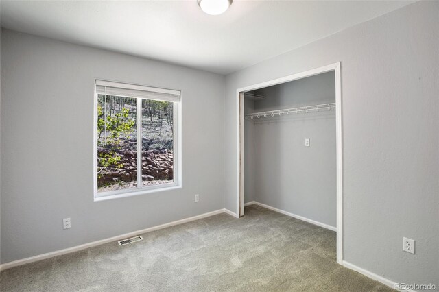 1536 County Road 1, Cripple Creek, CO 80813 - unfurnished bedroom featuring carpet floors, a closet, and baseboards