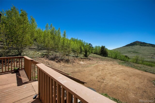 1536 County Road 1, Cripple Creek, CO 80813 - wooden terrace featuring a mountain view