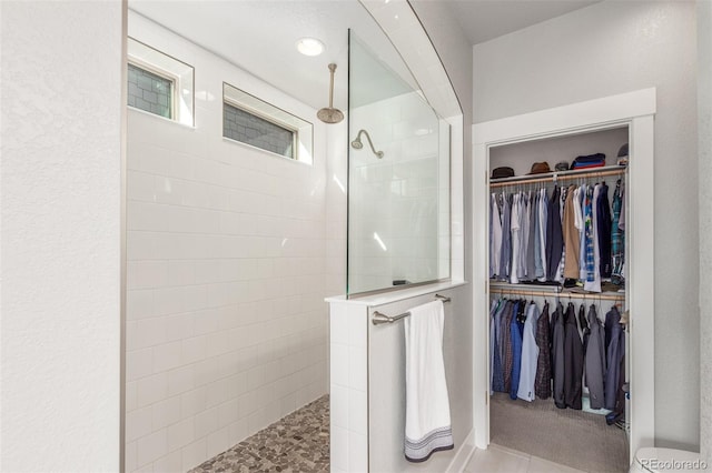 5735 Boston St, Denver, CO 80238 - bathroom with walk in shower and a spacious closet
