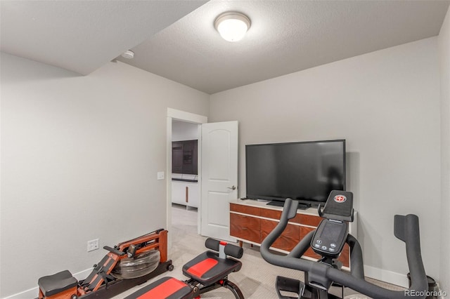 5735 Boston St, Denver, CO 80238 - exercise area featuring baseboards and a textured ceiling