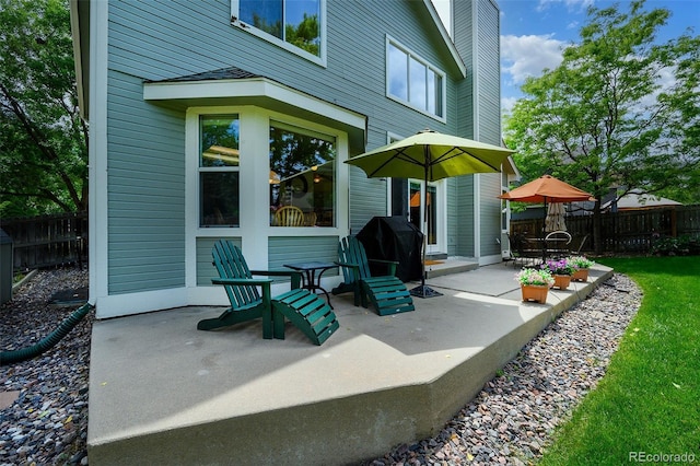 1387 Mcintosh Ave, Broomfield, CO 80020 - fenced backyard featuring a patio area and a grill