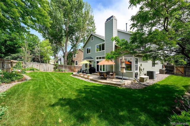 1387 Mcintosh Ave, Broomfield, CO 80020 - rear view of property featuring a patio, a fenced backyard, and a chimney
