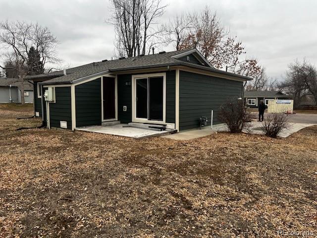 back of property with a patio area