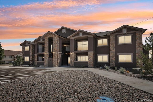 view of outdoor building at dusk