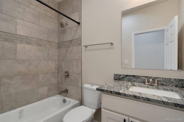 full bathroom featuring vanity, toilet, and tiled shower / bath combo