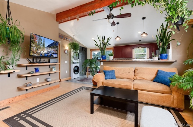 32 Magnum Bonum Dr, Breckenridge, CO 80424 - living area featuring stacked washing machine and dryer, ceiling fan, and wood finished floors