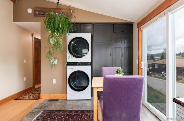 32 Magnum Bonum Dr, Breckenridge, CO 80424 - washroom featuring estacked washer and dryer, light wood-style floors, and baseboards