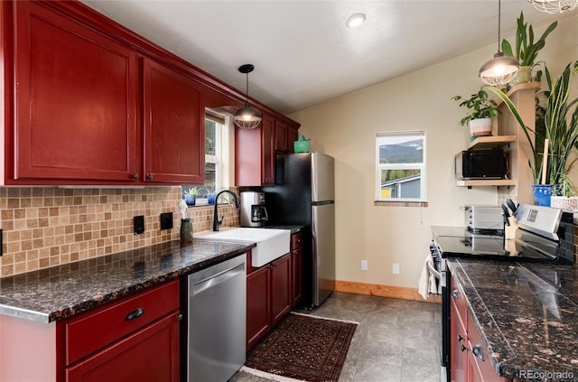 32 Magnum Bonum Dr, Breckenridge, CO 80424 - kitchen with stainless steel appliances, decorative backsplash, a sink, lofted ceiling, and baseboards