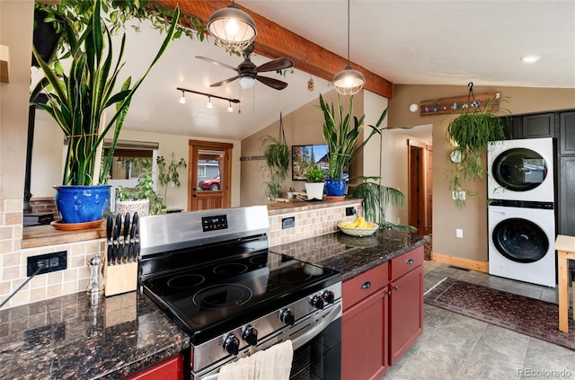 32 Magnum Bonum Dr, Breckenridge, CO 80424 - kitchen with stainless steel range with electric stovetop, stacked washing machine and dryer, ceiling fan, and pendant lighting