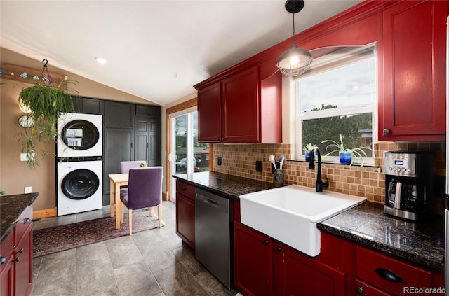 32 Magnum Bonum Dr, Breckenridge, CO 80424 - kitchen with stainless steel dishwasher, a sink, estacked washer and dryer, backsplash, and lofted ceiling