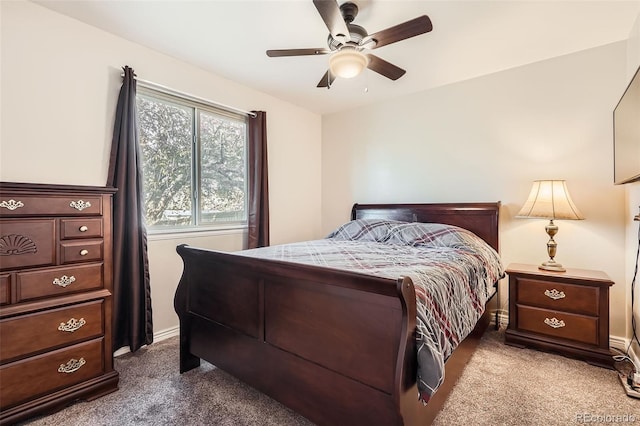 bedroom featuring carpet floors, a ceiling fan, and baseboards