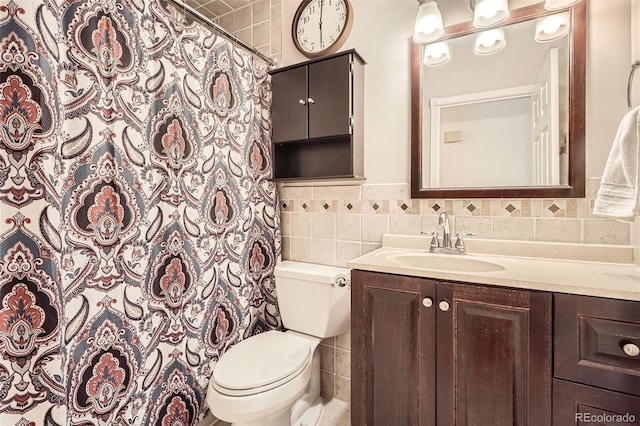 bathroom with a wainscoted wall, toilet, vanity, tile walls, and a shower with shower curtain