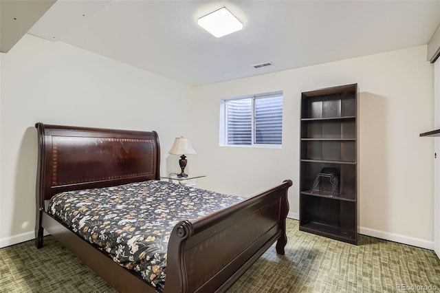 carpeted bedroom with baseboards and visible vents