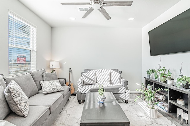 carpeted living room featuring ceiling fan