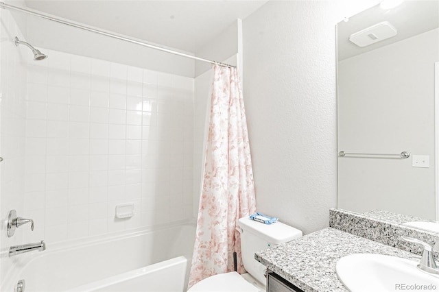 full bathroom with vanity, shower / bath combination with curtain, and toilet