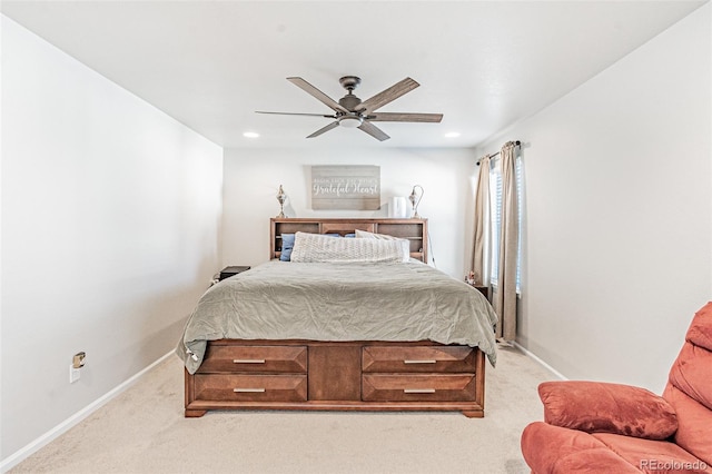 bedroom with light colored carpet and ceiling fan