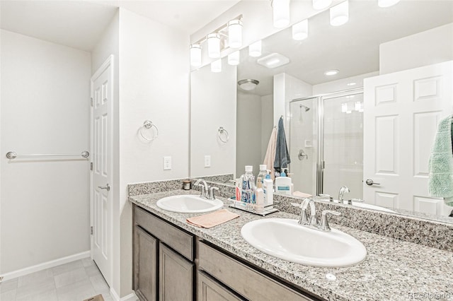 bathroom with vanity, tile patterned floors, and walk in shower