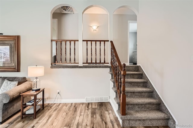 6238 S Cherry Cir, Centennial, CO 80121 - stairs with baseboards, wood finished floors, and visible vents